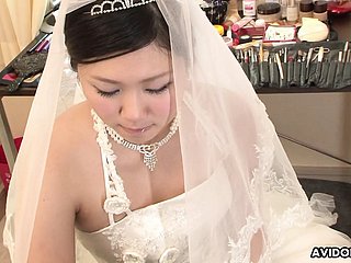 Brunette Emi Koizumi fucked atop wedding clothes uncensored.